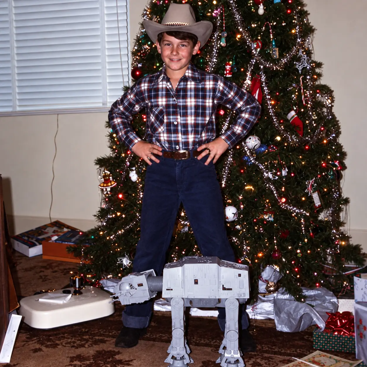 Nine-year-old David Acuff with an AT-AT toy at Christmas in 1981